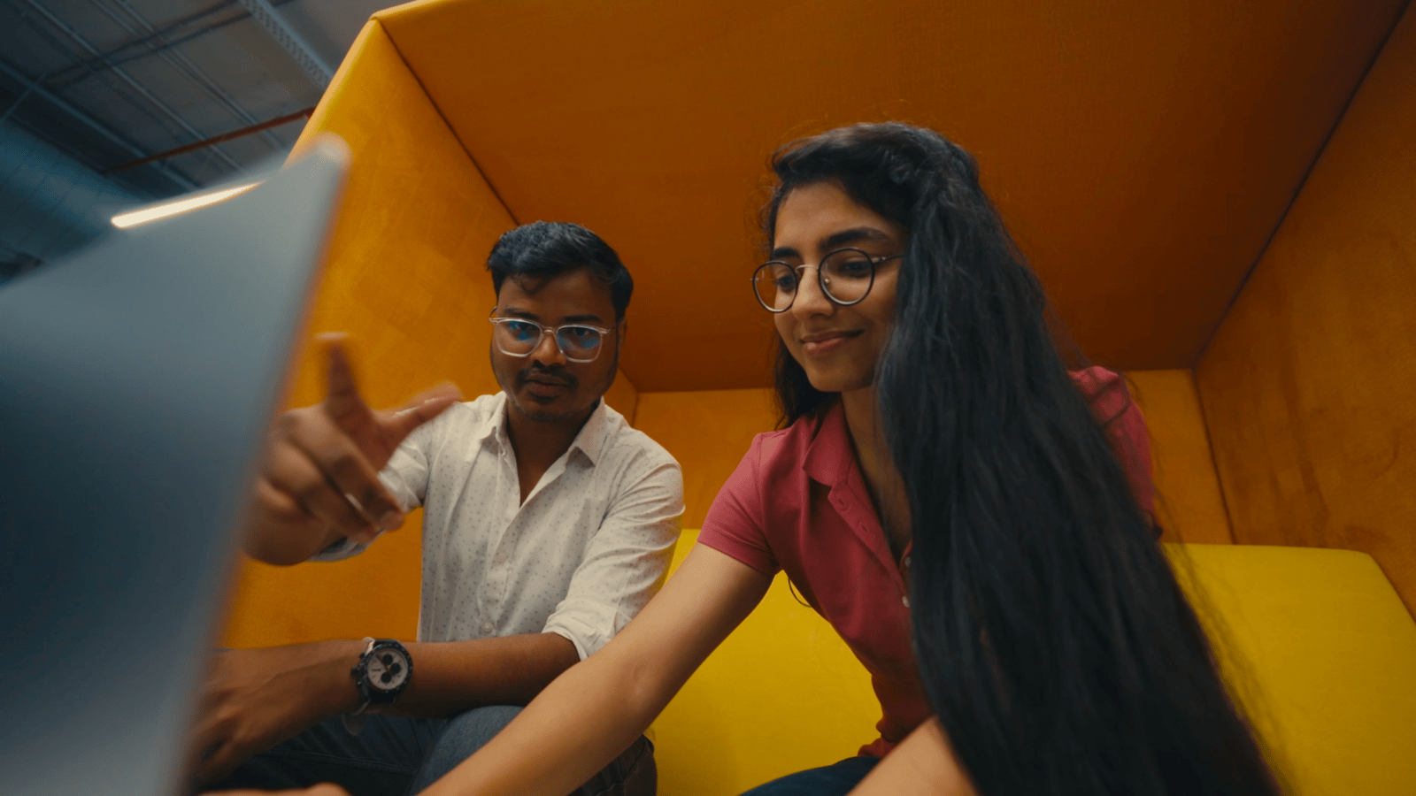 a person and person sitting in a box