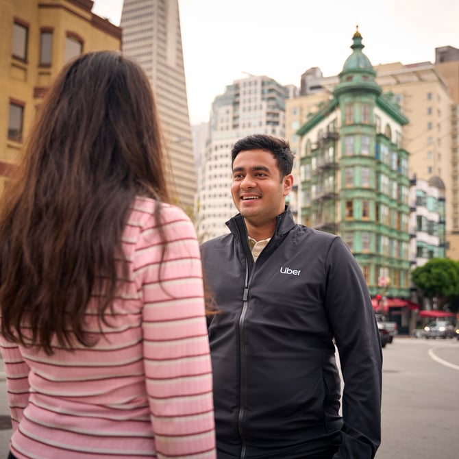 a person and person standing on a street