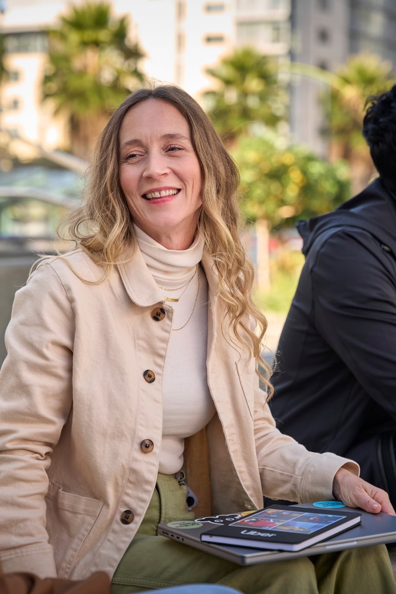 a person sitting on a bench with a group of people
