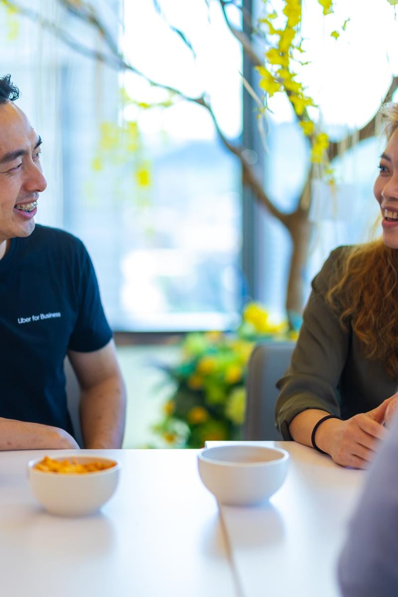 a person and person sitting at a table