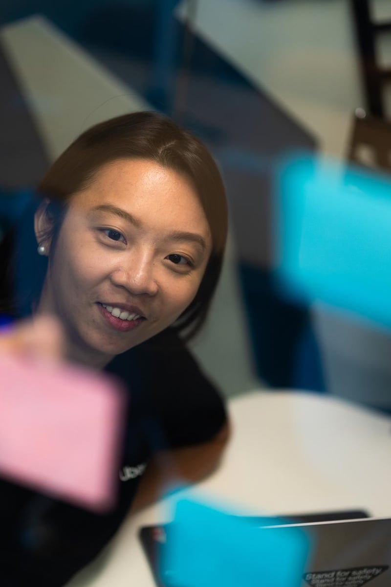 a person holding a post-it note