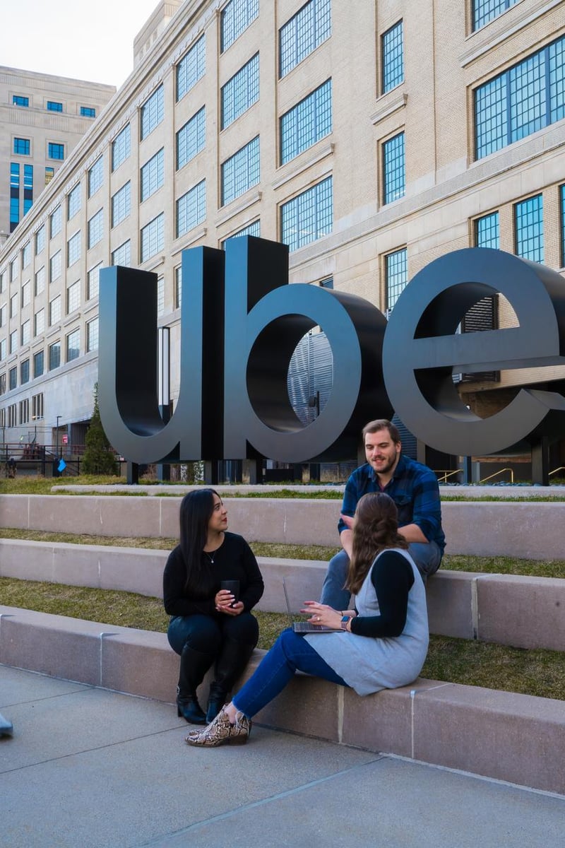 a group of people sitting on steps outside a building