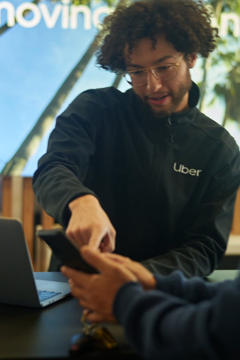 a person showing a phone to another person