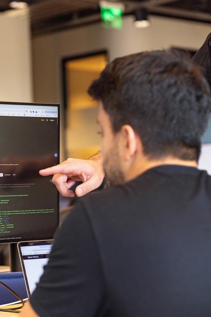 a person pointing at a computer screen