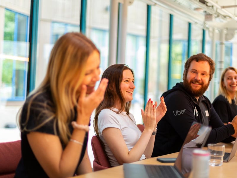a group of people clapping
