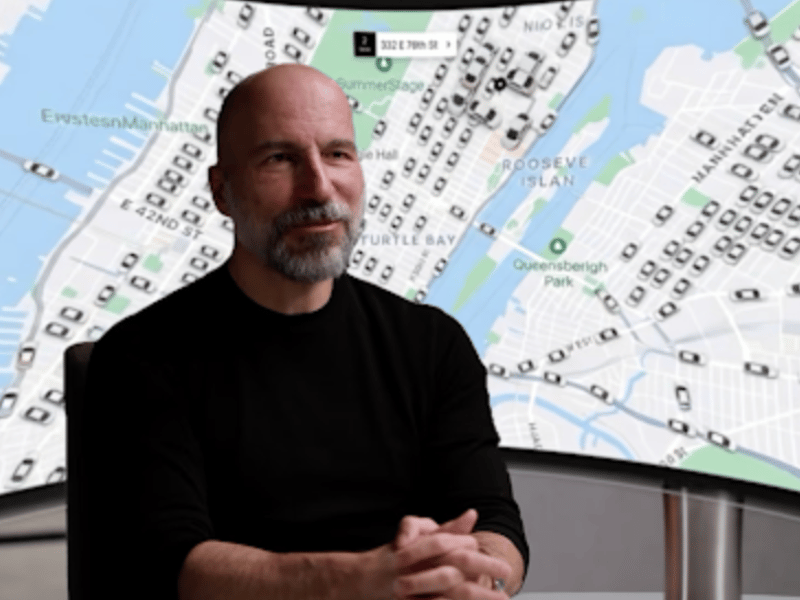 a person sitting in front of a map