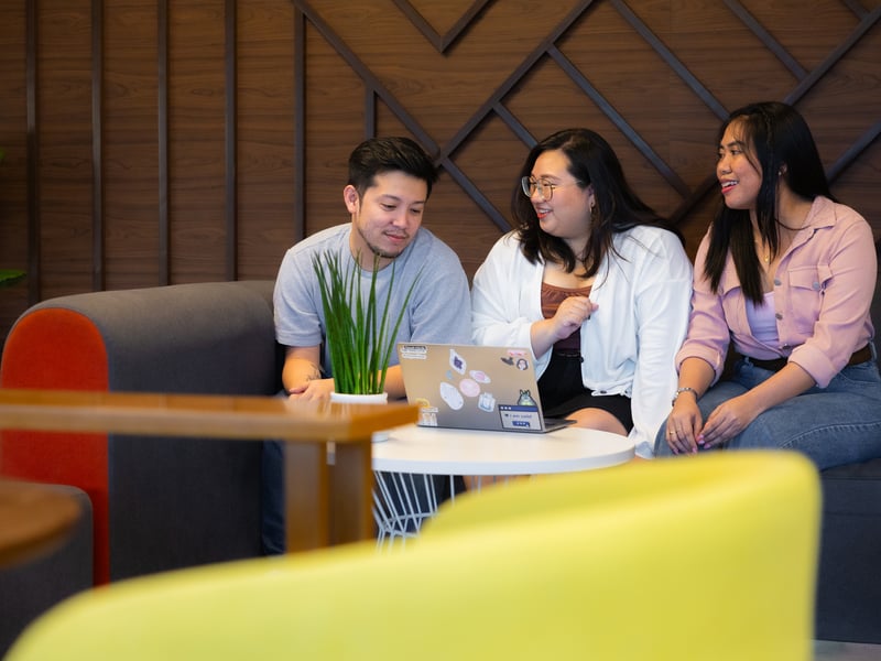 a group of people sitting around a table