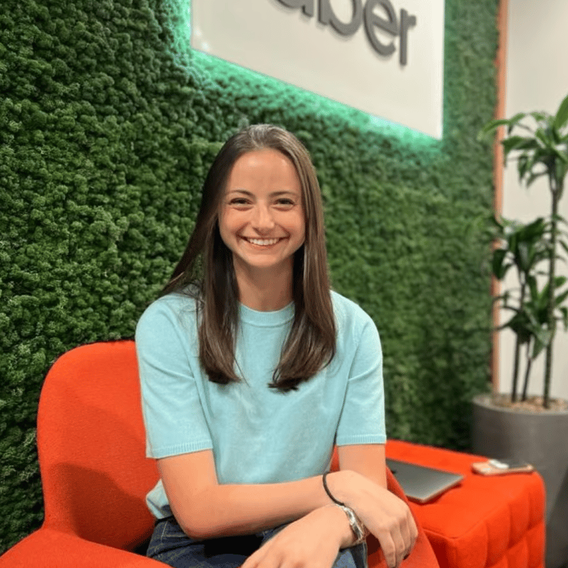 a person sitting in an orange chair