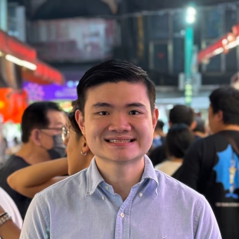 a person smiling at the camera