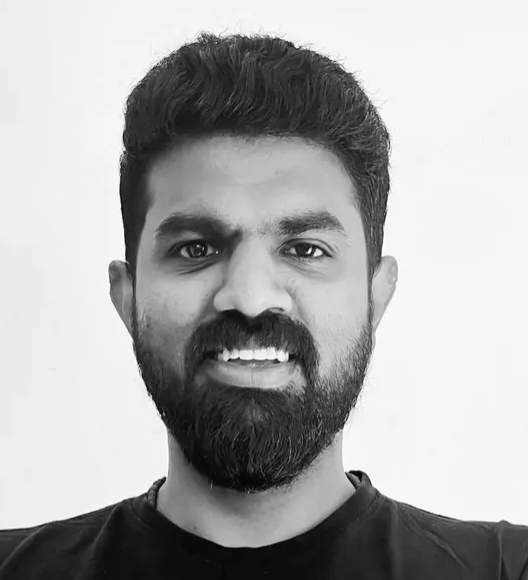 a person with a beard smiling