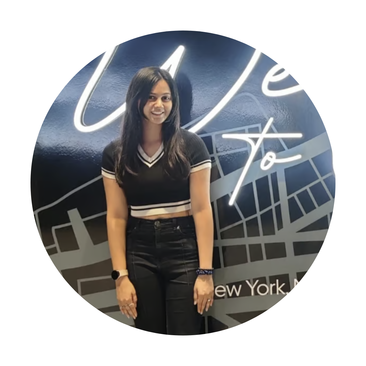 a person smiling in front of a sign