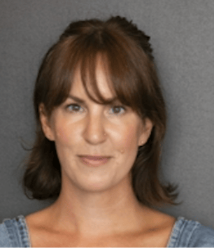 a person with brown hair and bangs