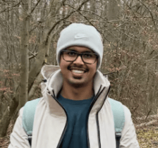 a person wearing a hat and glasses