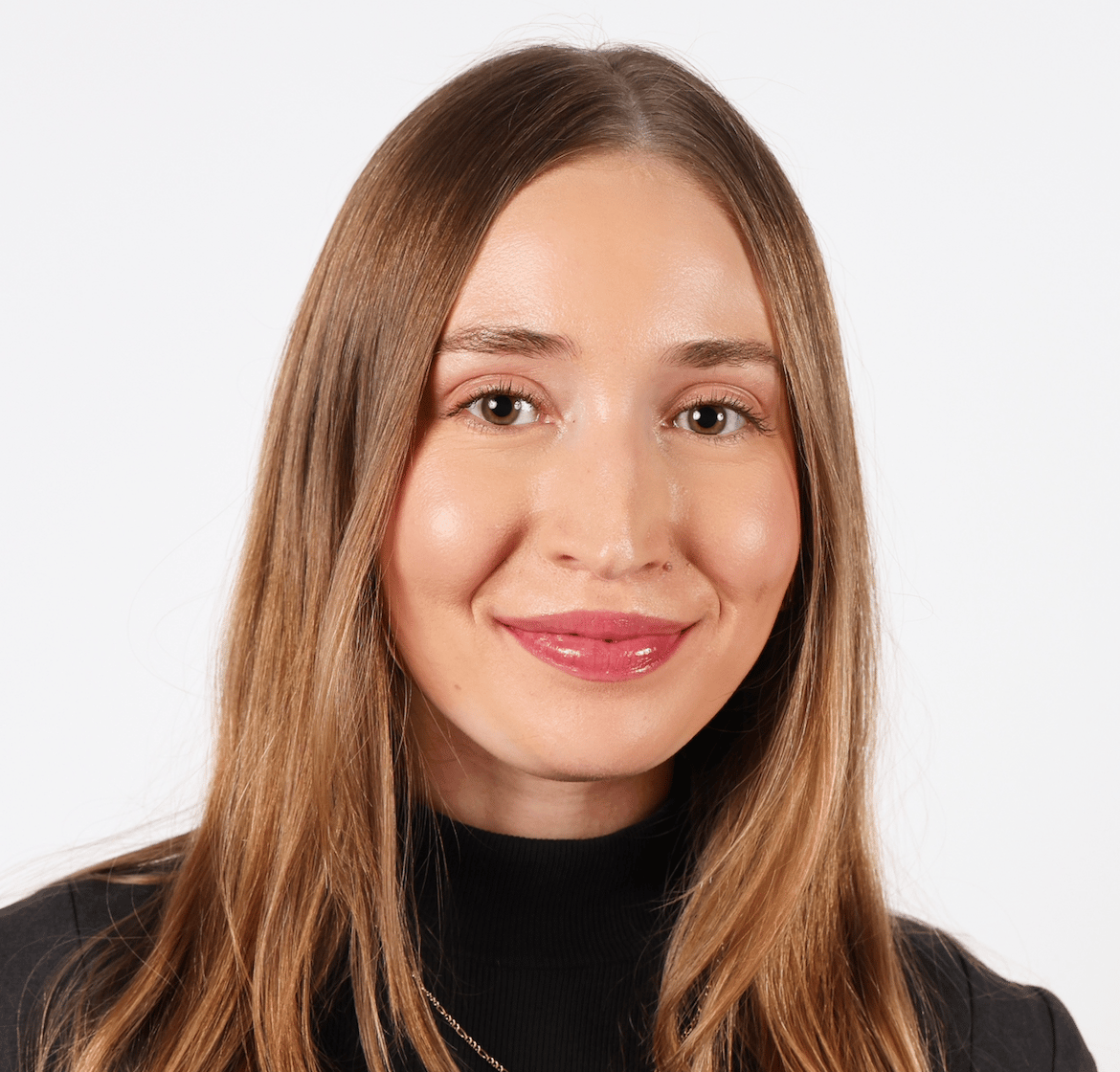 a person with long hair smiling
