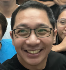 a person smiling at the camera
