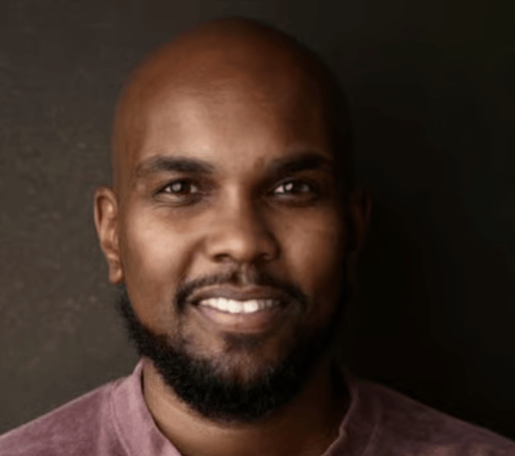 a person smiling at the camera