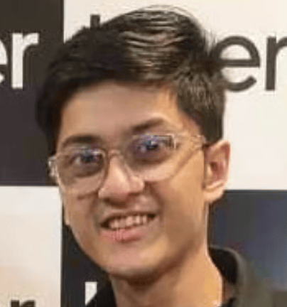 a person wearing glasses smiling