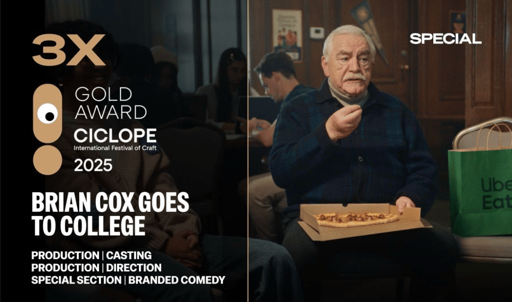 a person sitting in a chair eating a pizza
