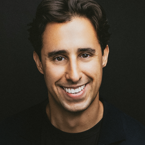 a person smiling at the camera