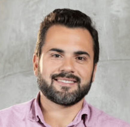 a person with a beard smiling