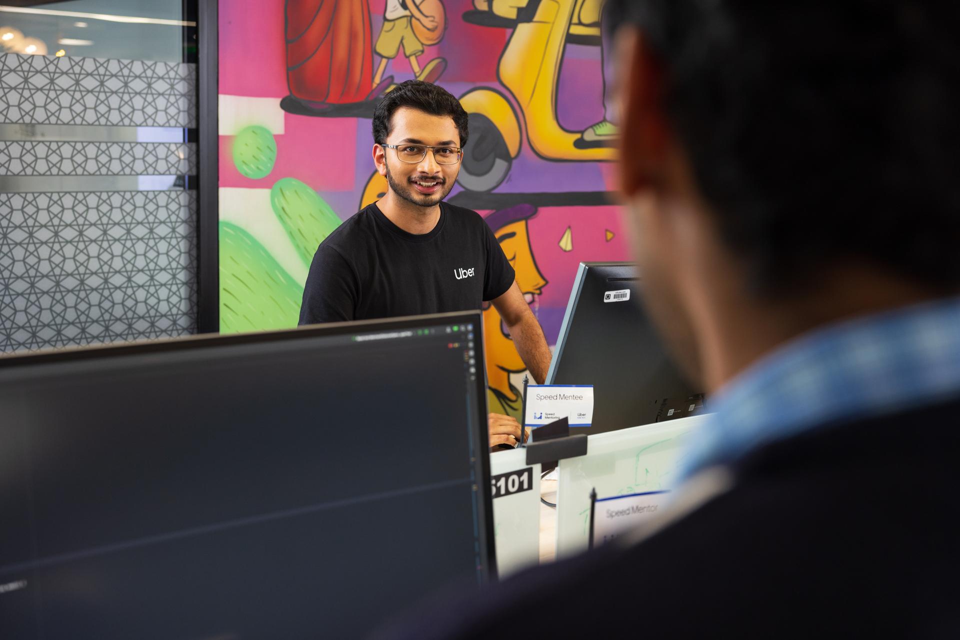 a person standing in front of a computer