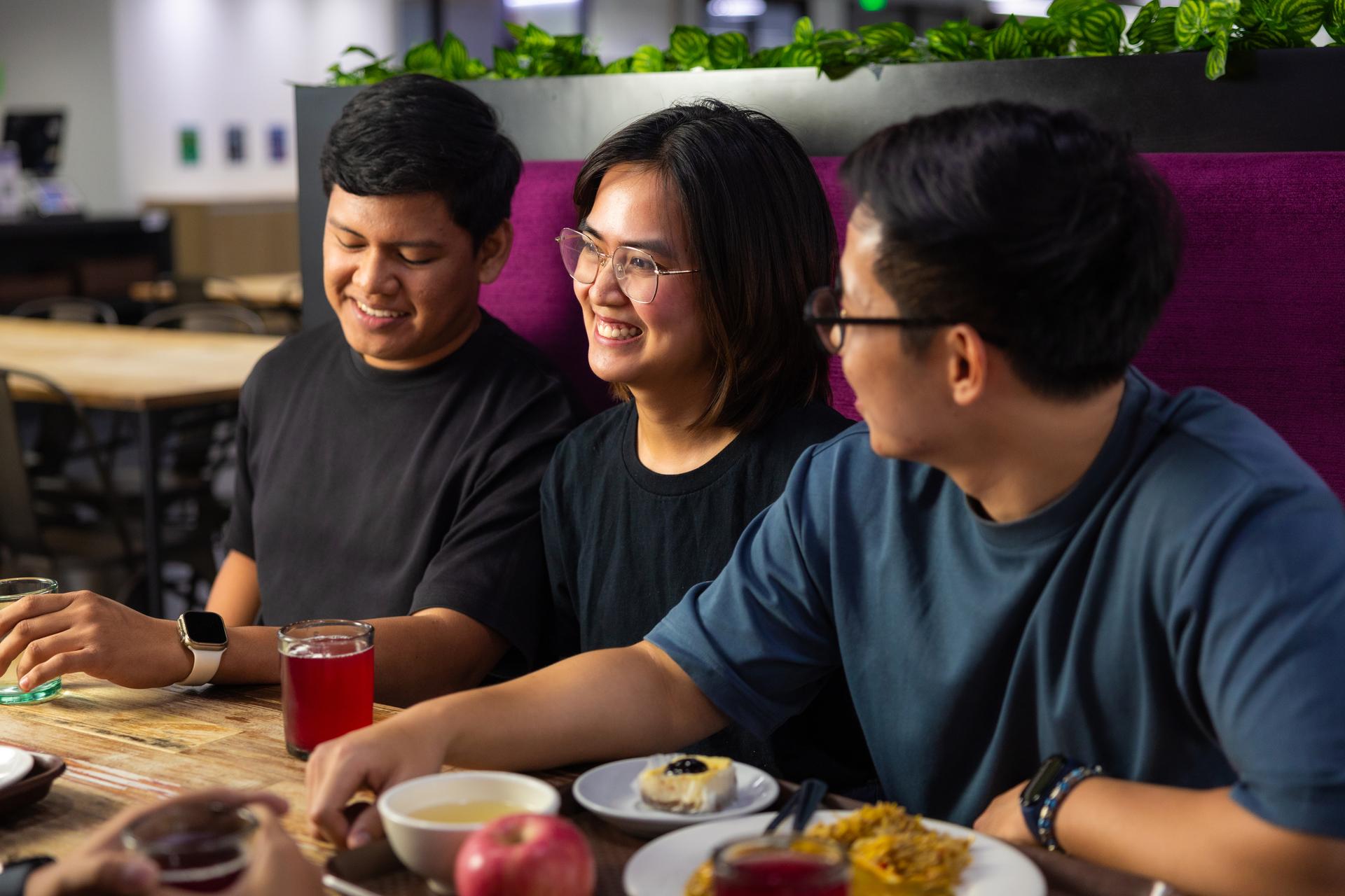 a group of people sitting at a table
