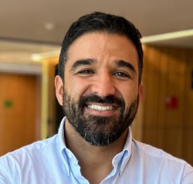 a person with a beard smiling